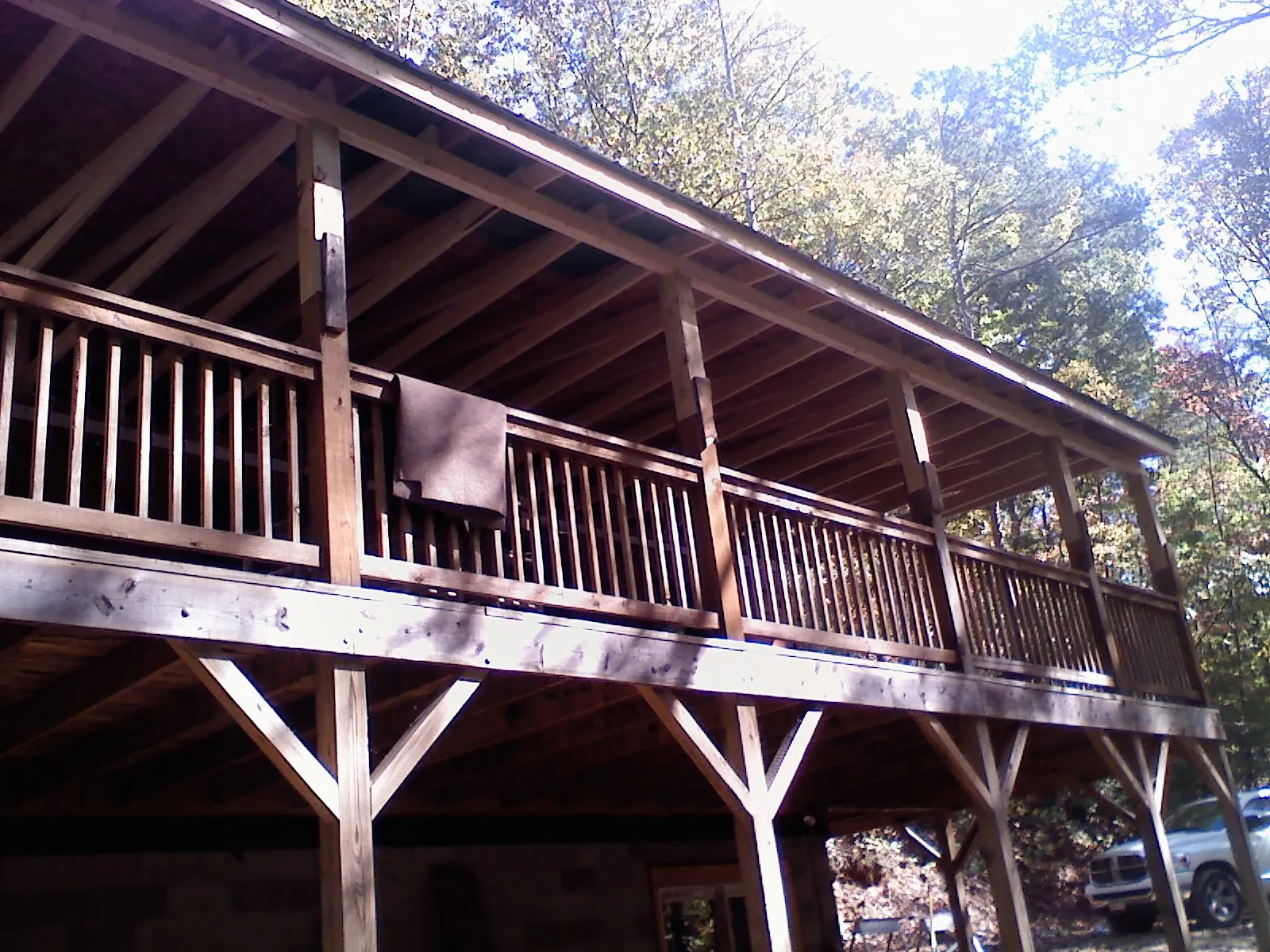 Timber framing under a new elevated porch and deck — Roof Leak Repair in Villard by Roofing Brothers